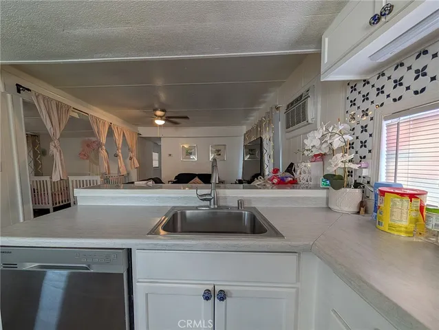 a kitchen with a sink and a refrigerator