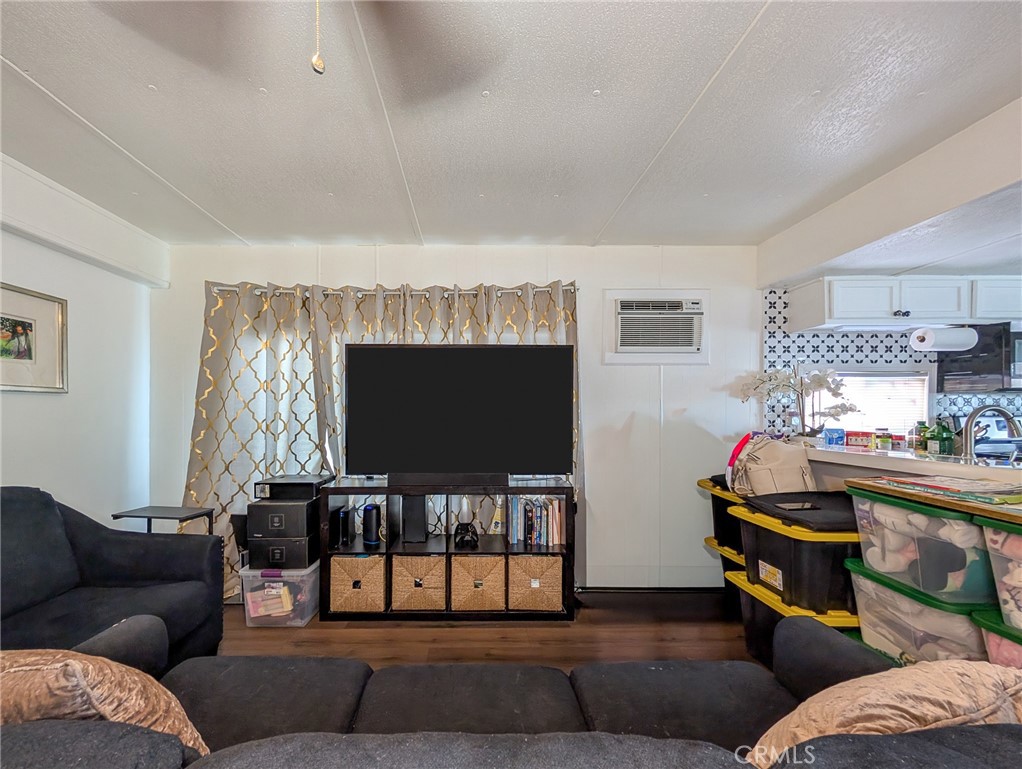 28 Jupiter Street Palm Springs, CA 92264 - Photo 5 of 26 a living room with furniture and a flat screen tv