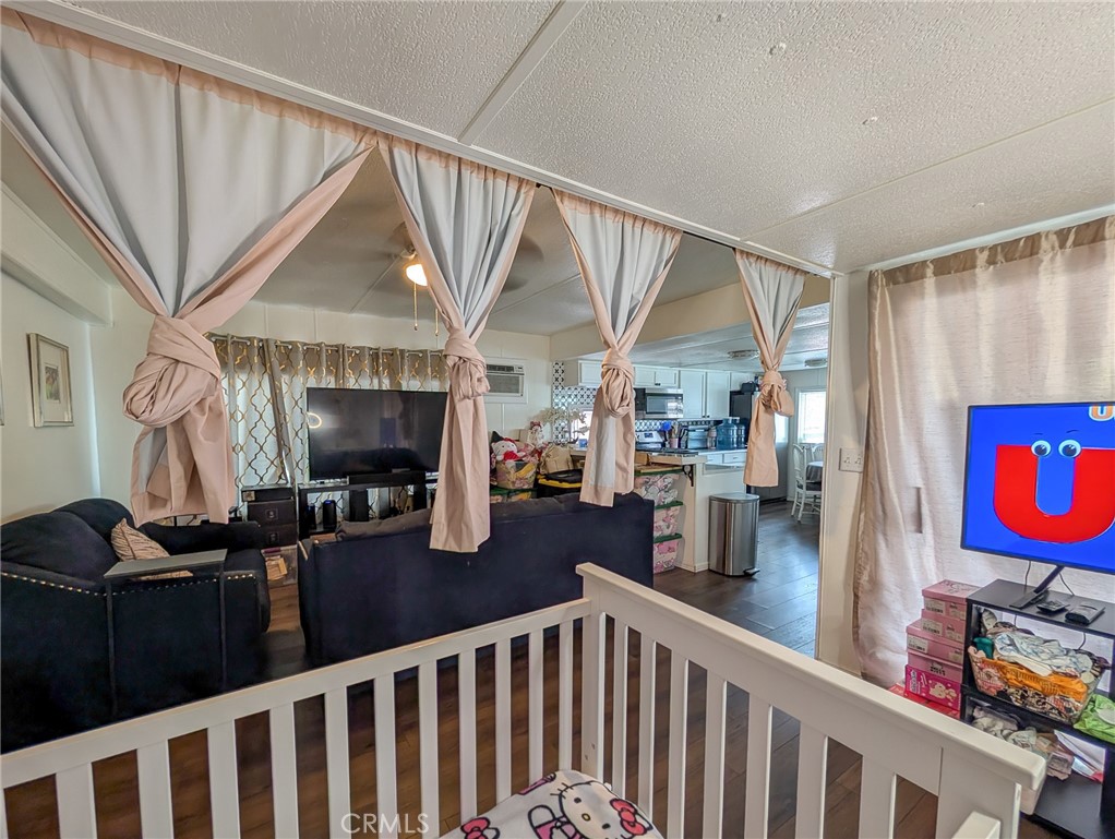28 Jupiter Street Palm Springs, CA 92264 - Photo 7 of 26 a view of a livingroom with furniture and a flat screen tv