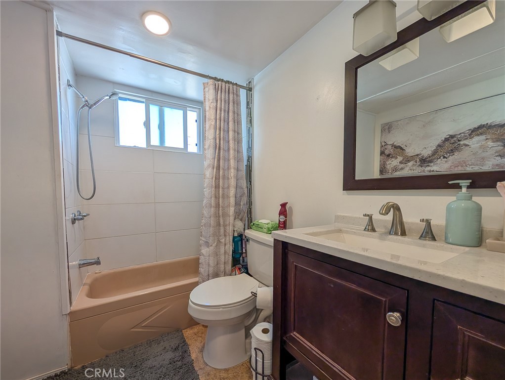 28 Jupiter Street Palm Springs, CA 92264 - Photo 9 of 26 a bathroom with a sink a toilet and shower