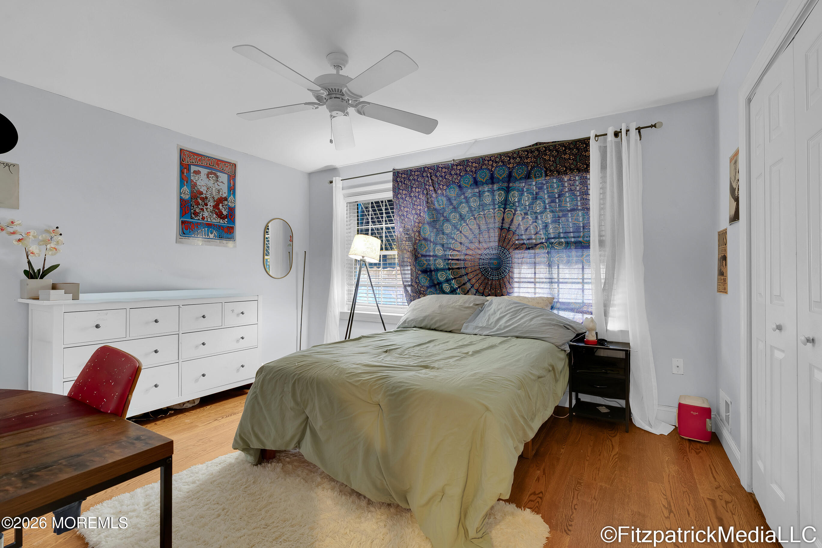 331 Richmond Avenue Point Pleasant Beach, NJ 08742 - Photo 26 of 46 a bedroom with a bed and a chandelier