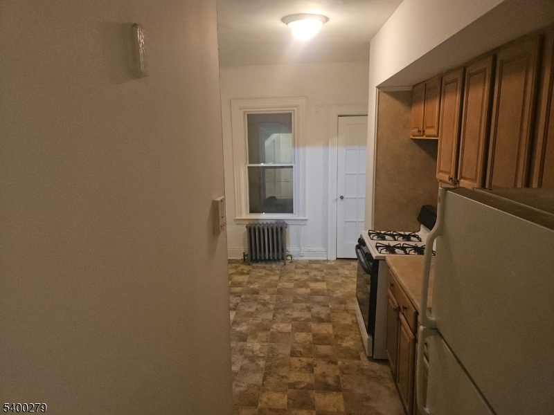 69 Passaic Street Garfield, NJ 07026 - Photo 4 of 6 wooden floor in a gallery