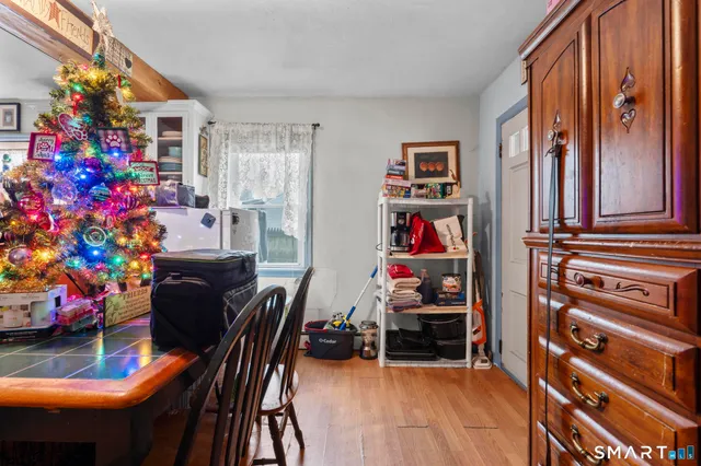 a utility room with lots of clutter and cabinets
