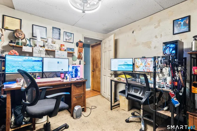 a room with gym equipment and a mirror