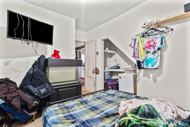 a bedroom with a bed and a table