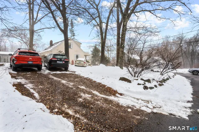 a view of a road with a stove covered with snow
