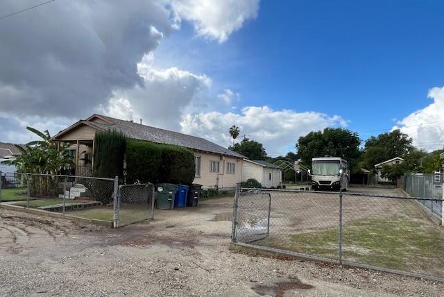 521 Temescal Street Piru, CA 93040 - Photo 2 of 16 a view of a chairs and table in the back yard