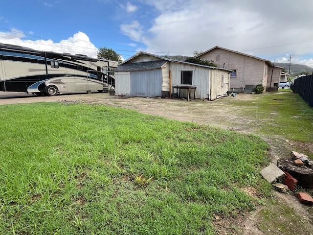 521 Temescal Street Piru, CA 93040 - Photo 6 of 16 a car parked in front of house with a yard