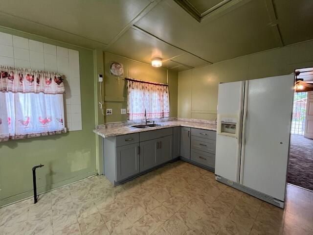 521 Temescal Street Piru, CA 93040 - Photo 9 of 16 a kitchen with granite countertop a refrigerator and a sink