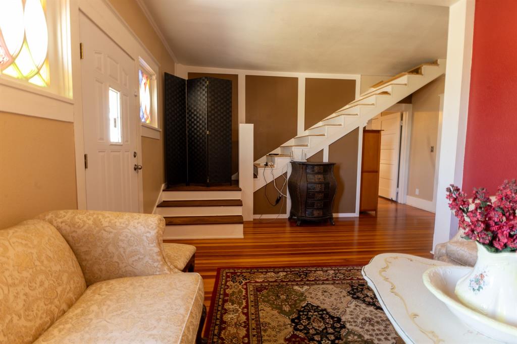 1115 Austin Street Coleman, TX 76834 - Photo 19 of 40 a living room with furniture and stairs