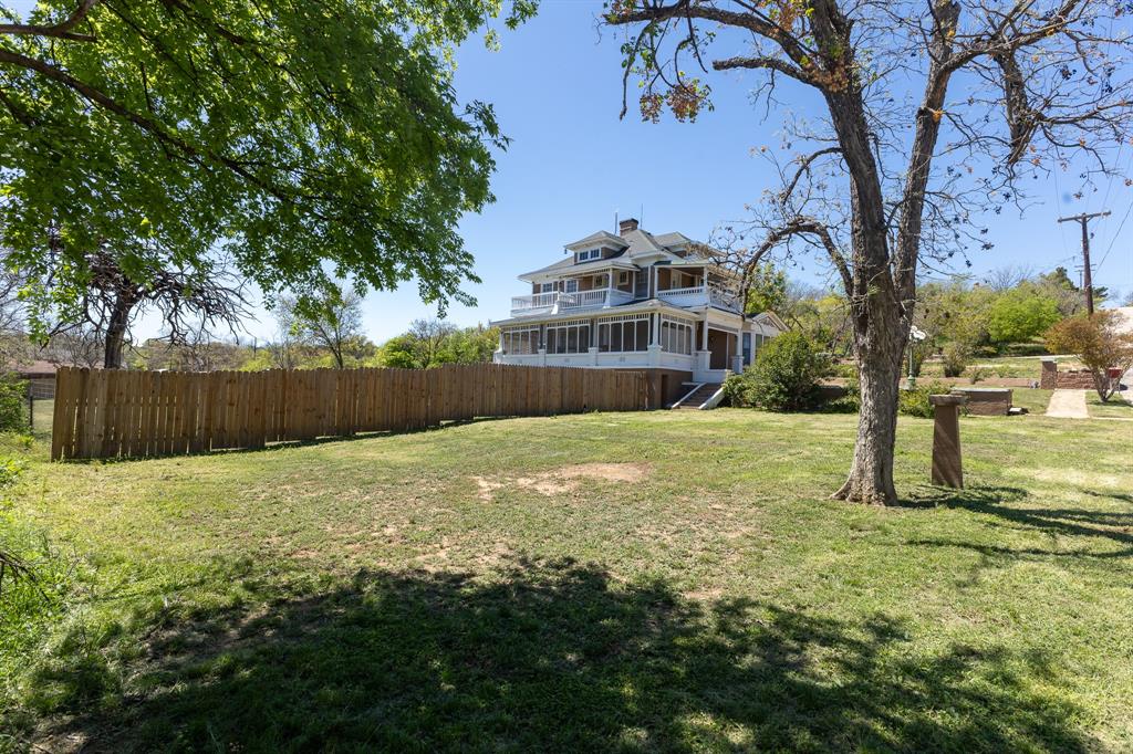 1115 Austin Street Coleman, TX 76834 - Photo 40 of 40 a view of outdoor space with garden and trees