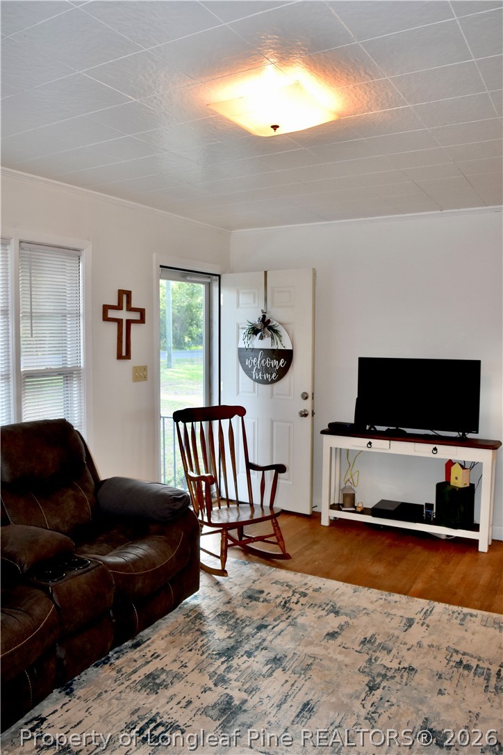 5309 Tobacco Road Orrum, NC 28369 - Photo 27 of 44 a living room with furniture and a flat screen tv