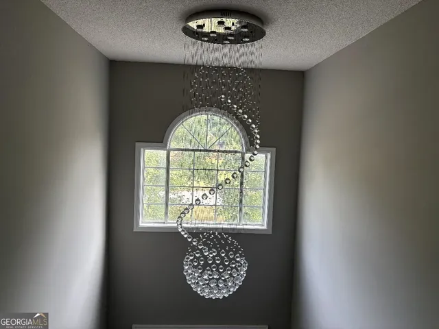 an outdoor space view with a large window and mirror