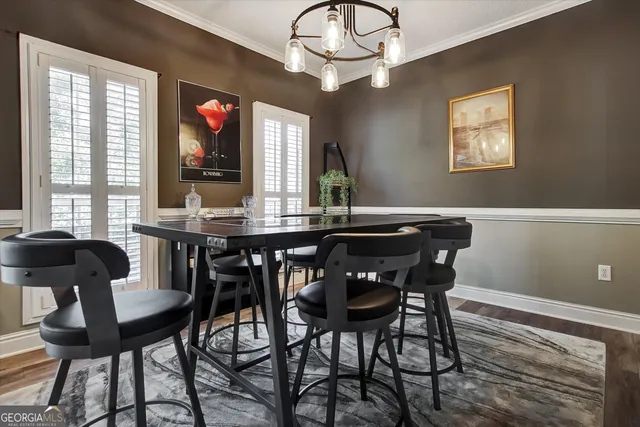 a view of a dining room with furniture and window