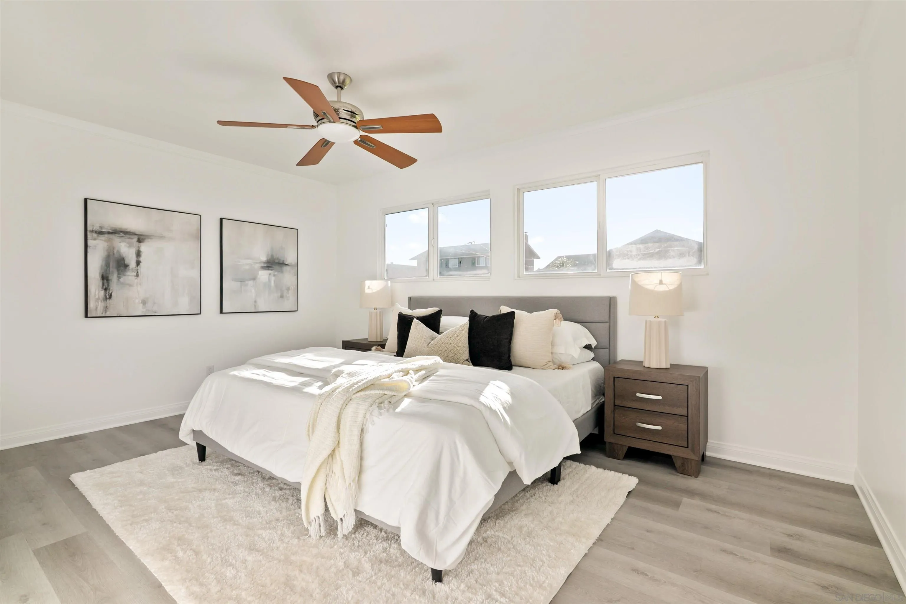 2015 Ainsley Road San Diego, CA 92123 - Photo 21 of 54 a bedroom with a bed and window