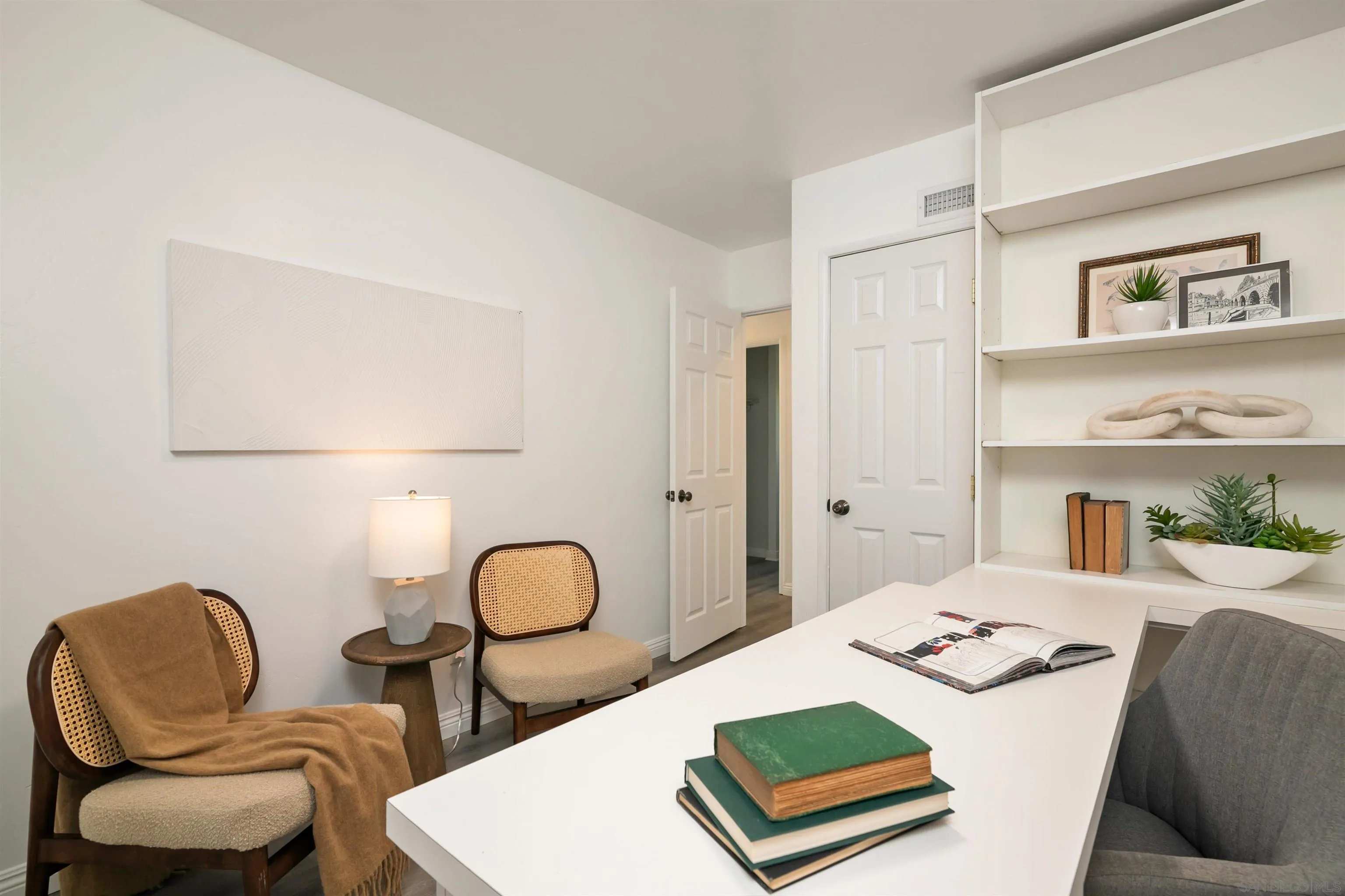 2015 Ainsley Road San Diego, CA 92123 - Photo 25 of 54 a living room with furniture and a rug