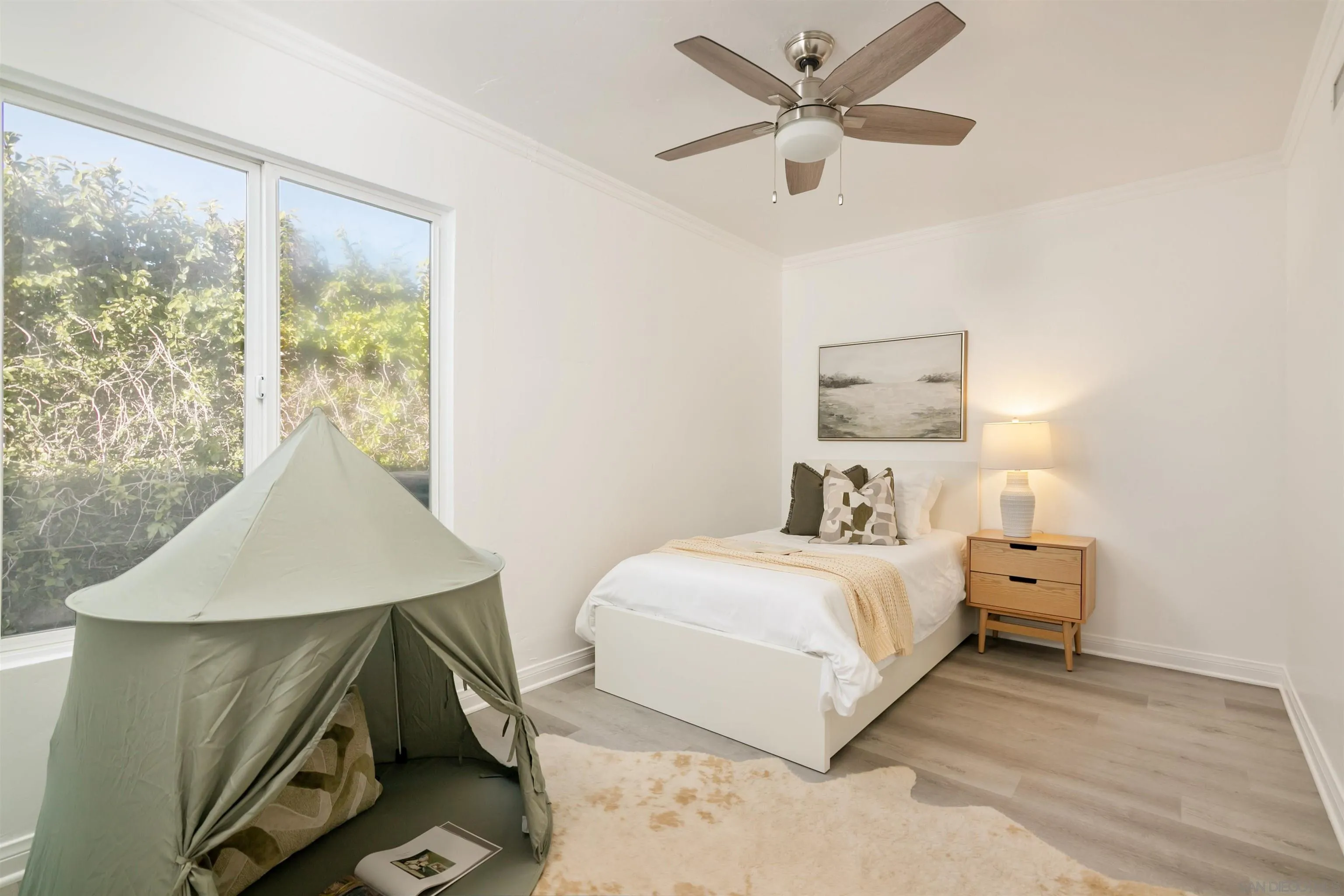 2015 Ainsley Road San Diego, CA 92123 - Photo 26 of 54 a bedroom with a bed and a large window