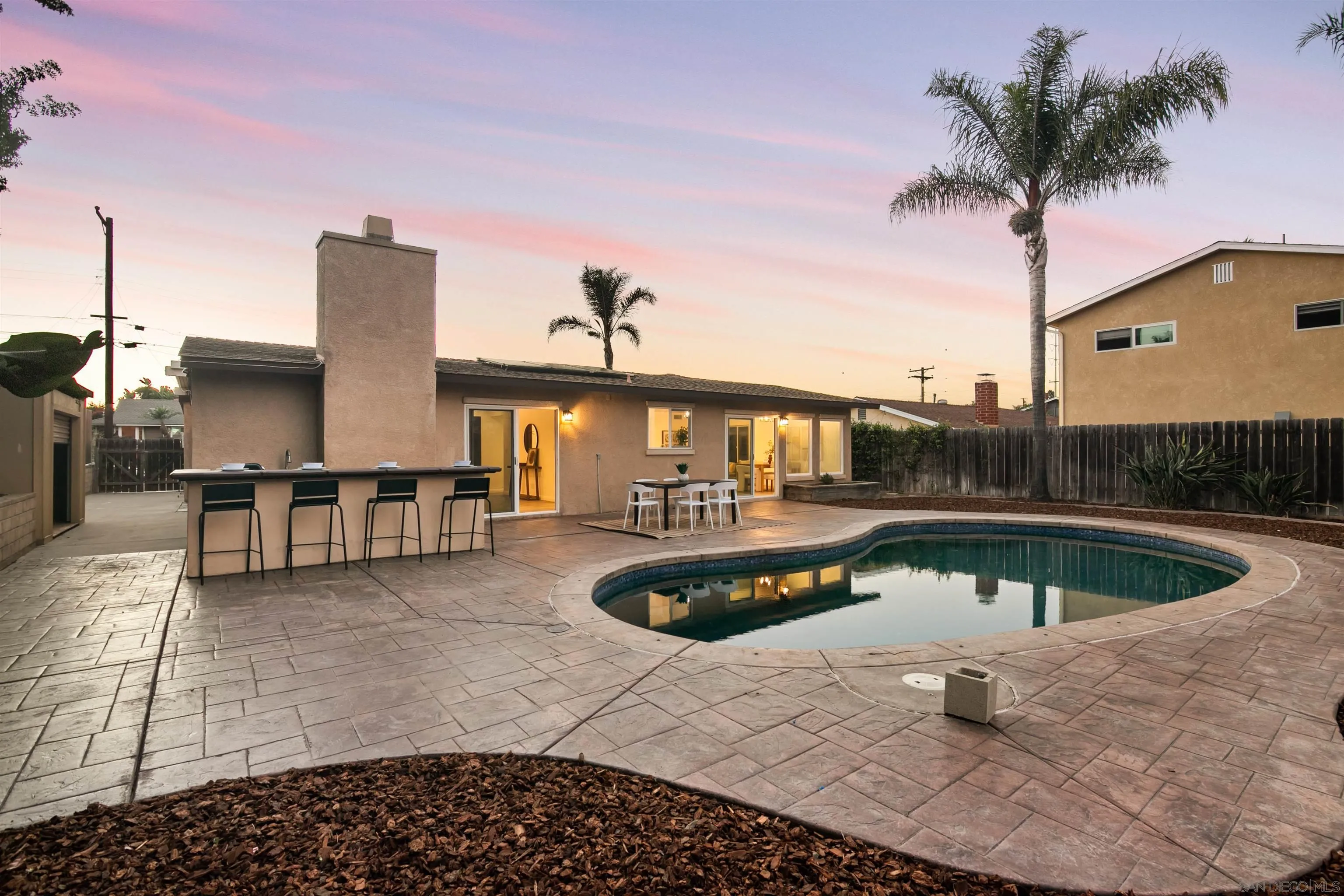 2015 Ainsley Road San Diego, CA 92123 - Photo 6 of 54 a view of a swimming pool with a lounge chair