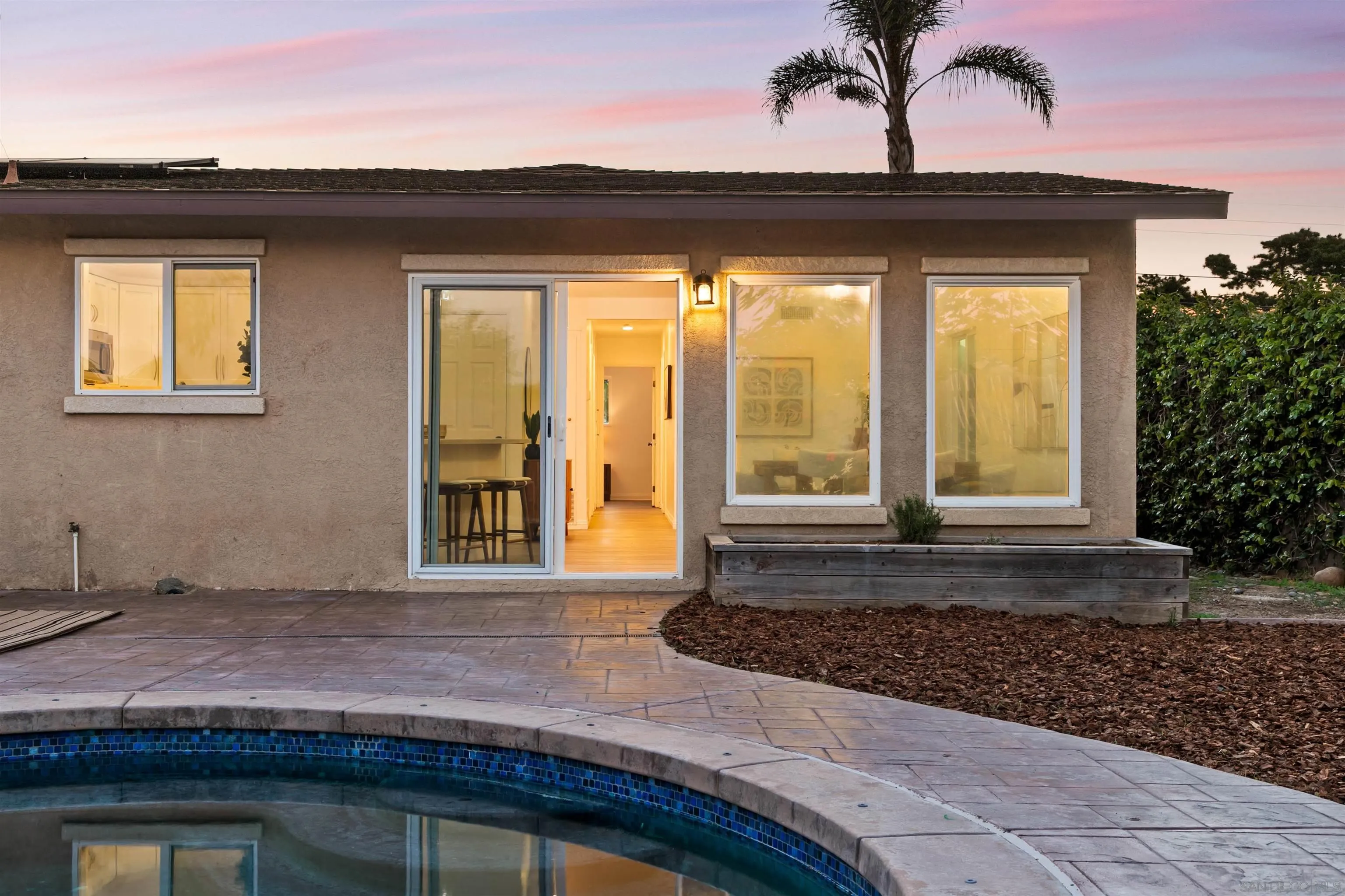 2015 Ainsley Road San Diego, CA 92123 - Photo 7 of 54 a front view of a house with a yard