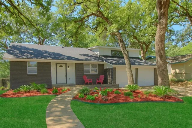 front view of a house with a yard