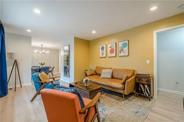 a living room with furniture and a table