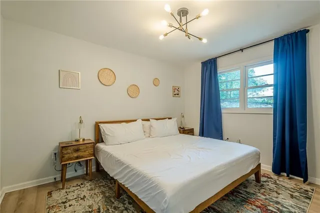 a bedroom with a large bed and a window