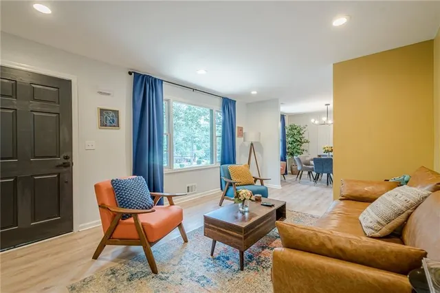 a living room with furniture and a window