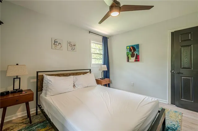 a bedroom with a bed and a table