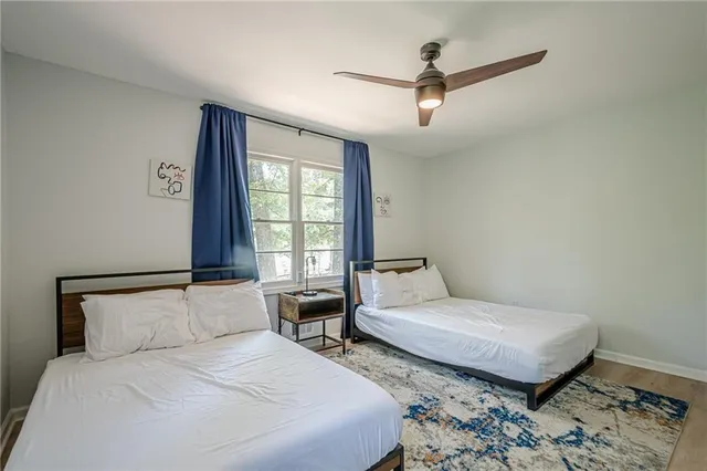 a bedroom with a bed and window