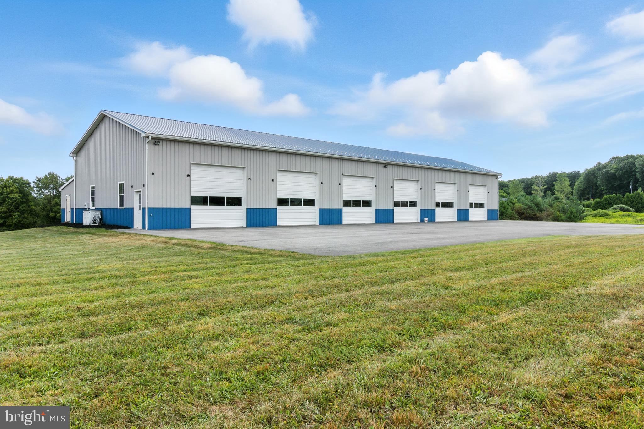 a view of a house next to a big yard