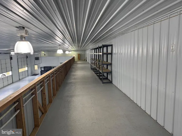 a view of a studio with wooden roof