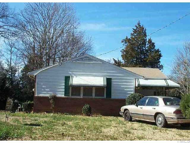 505 Chamberlain Street Raleigh, NC 27607 - Photo 1 of 1 a front view of a house with a yard