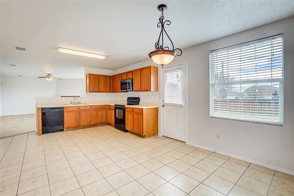 a view of kitchen and windows