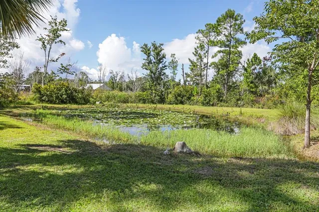 a view of a house with backyard