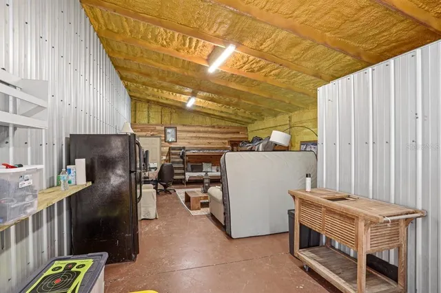 a bathroom with a toilet a sink and shower