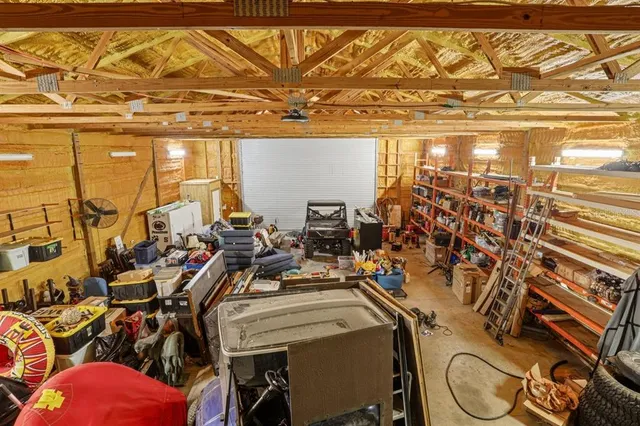 an aerial view of a house with a yard and garden