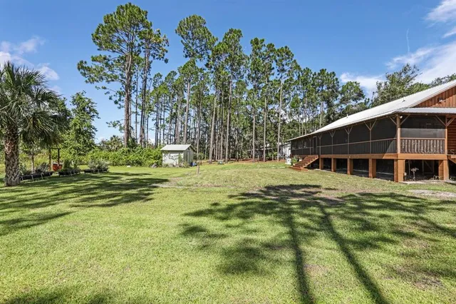 a view of a house with a big yard