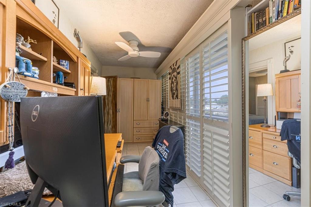 5 High Point Circle West, Unit 308 Naples, FL 34103 - Photo 16 of 28 a view of living room next to a window