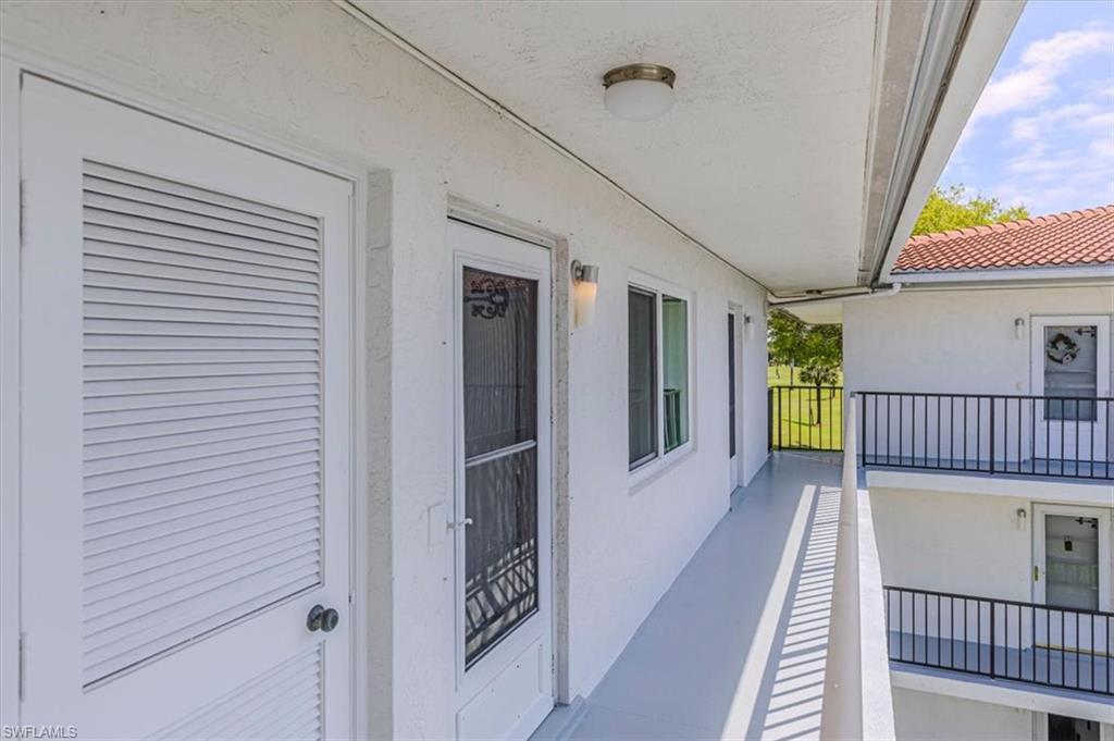 5 High Point Circle West, Unit 308 Naples, FL 34103 - Photo 21 of 28 a view of a hallway with entryway door front door