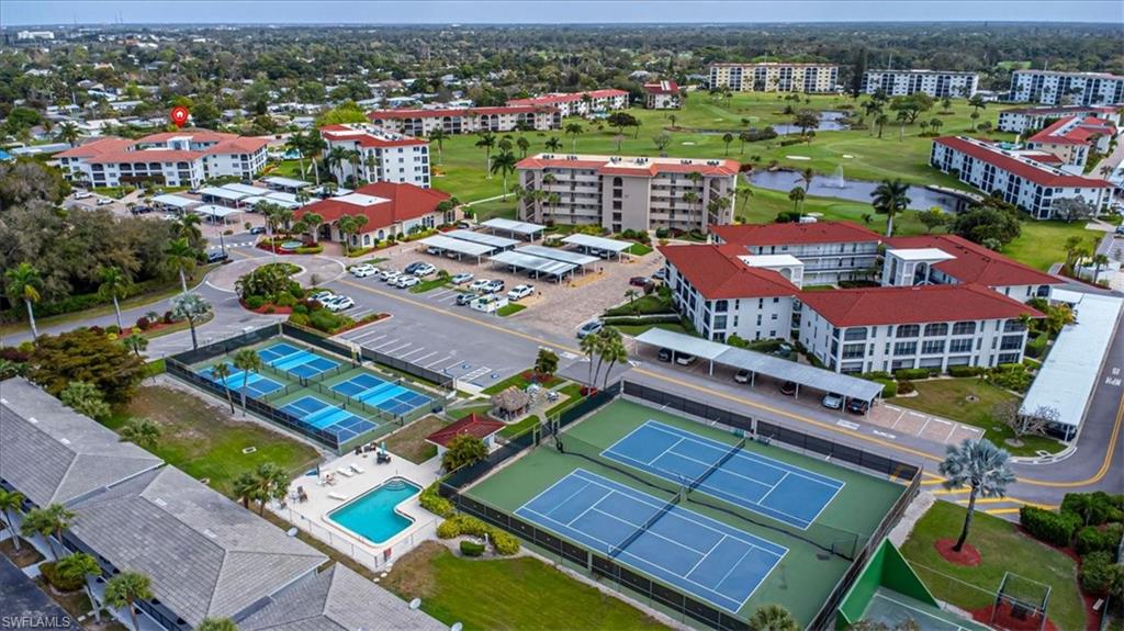 5 High Point Circle West, Unit 308 Naples, FL 34103 - Photo 3 of 28 an aerial view of a houses with a city view