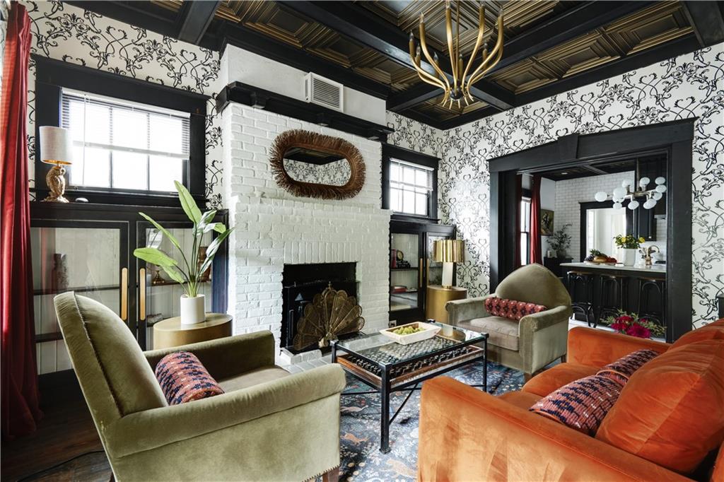 950 Austin Avenue Northeast Atlanta, GA 30307 - Photo 1 of 32 a living room with furniture a flat screen tv and a fireplace