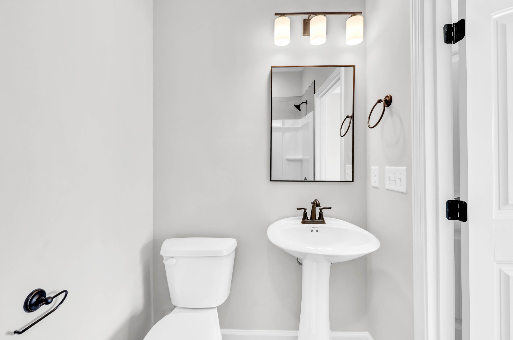2395 Pea Ridge Road Clarksville, TN 37040 - Photo 15 of 36 a bathroom with a sink a toilet and mirror