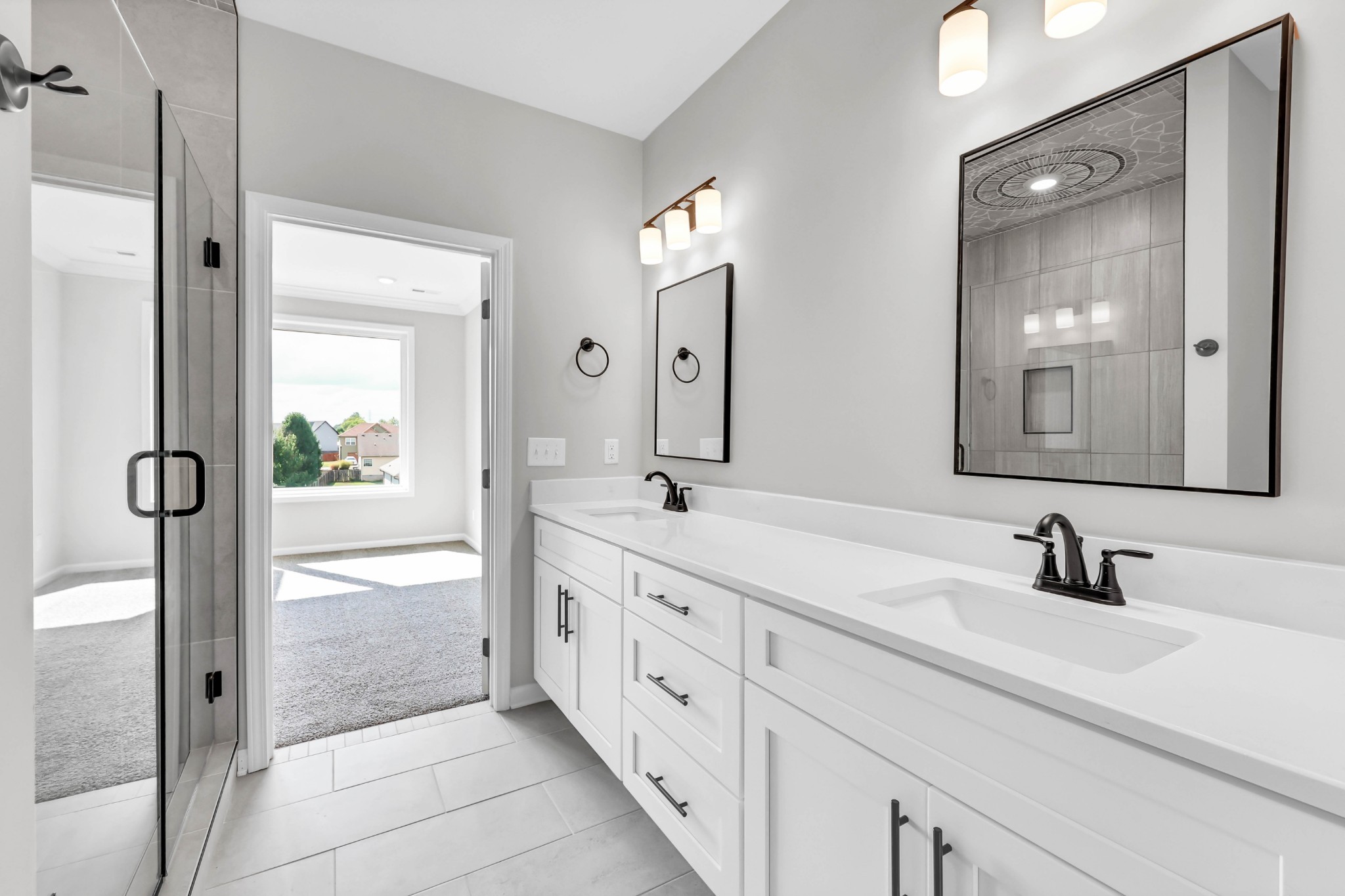 2395 Pea Ridge Road Clarksville, TN 37040 - Photo 19 of 36 a spacious bathroom with double vanity and mirrors