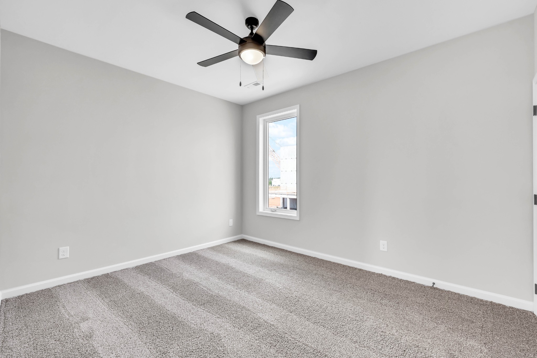2395 Pea Ridge Road Clarksville, TN 37040 - Photo 25 of 36 an empty room with a window and a fan