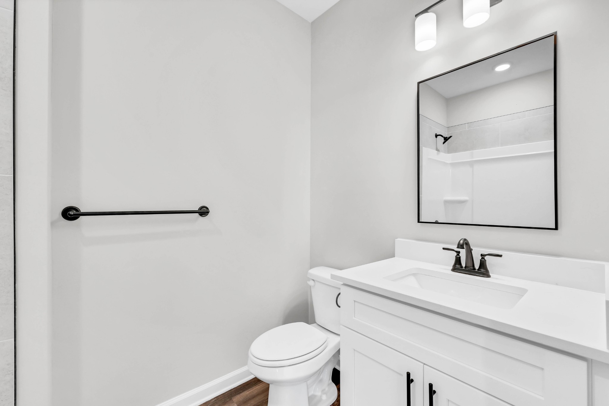 2395 Pea Ridge Road Clarksville, TN 37040 - Photo 30 of 36 a bathroom with a sink a toilet and a mirror