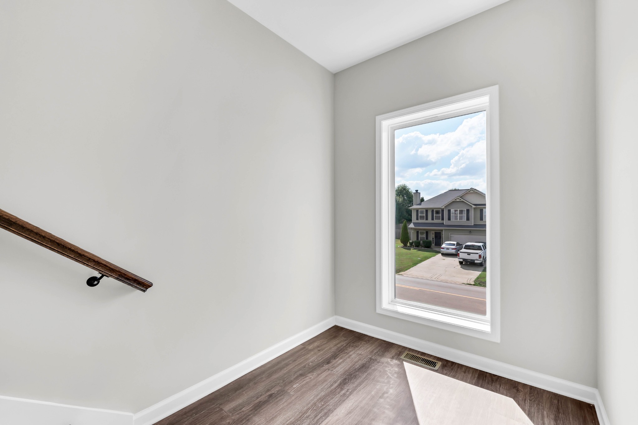 2395 Pea Ridge Road Clarksville, TN 37040 - Photo 32 of 36 a view of a hallway with wooden floor and a bathroom