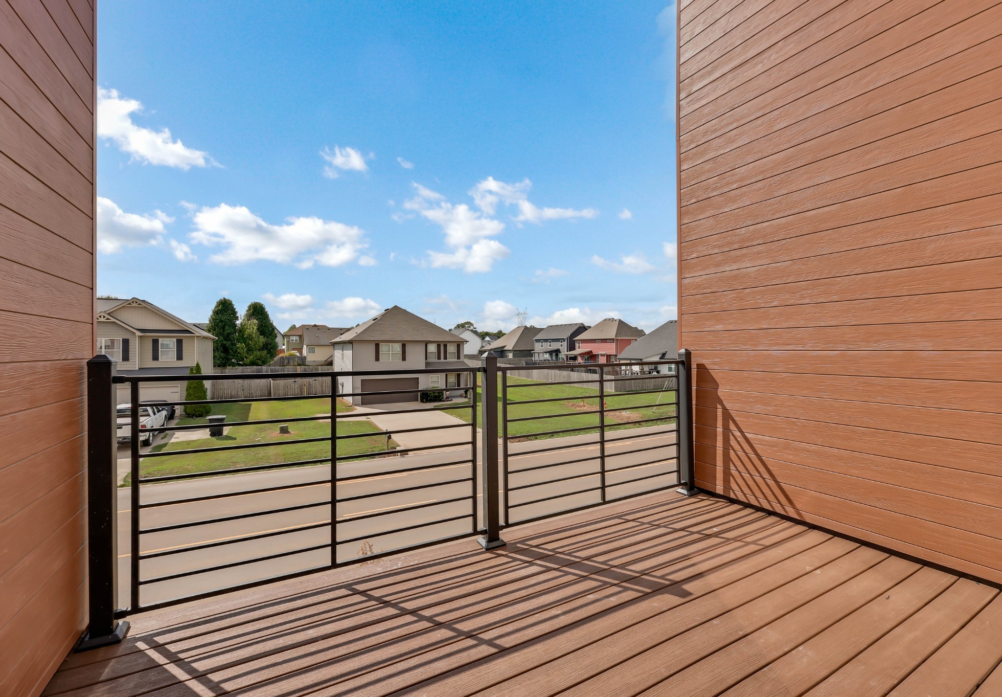 2395 Pea Ridge Road Clarksville, TN 37040 - Photo 33 of 36 a view of a balcony with wooden floor and city view
