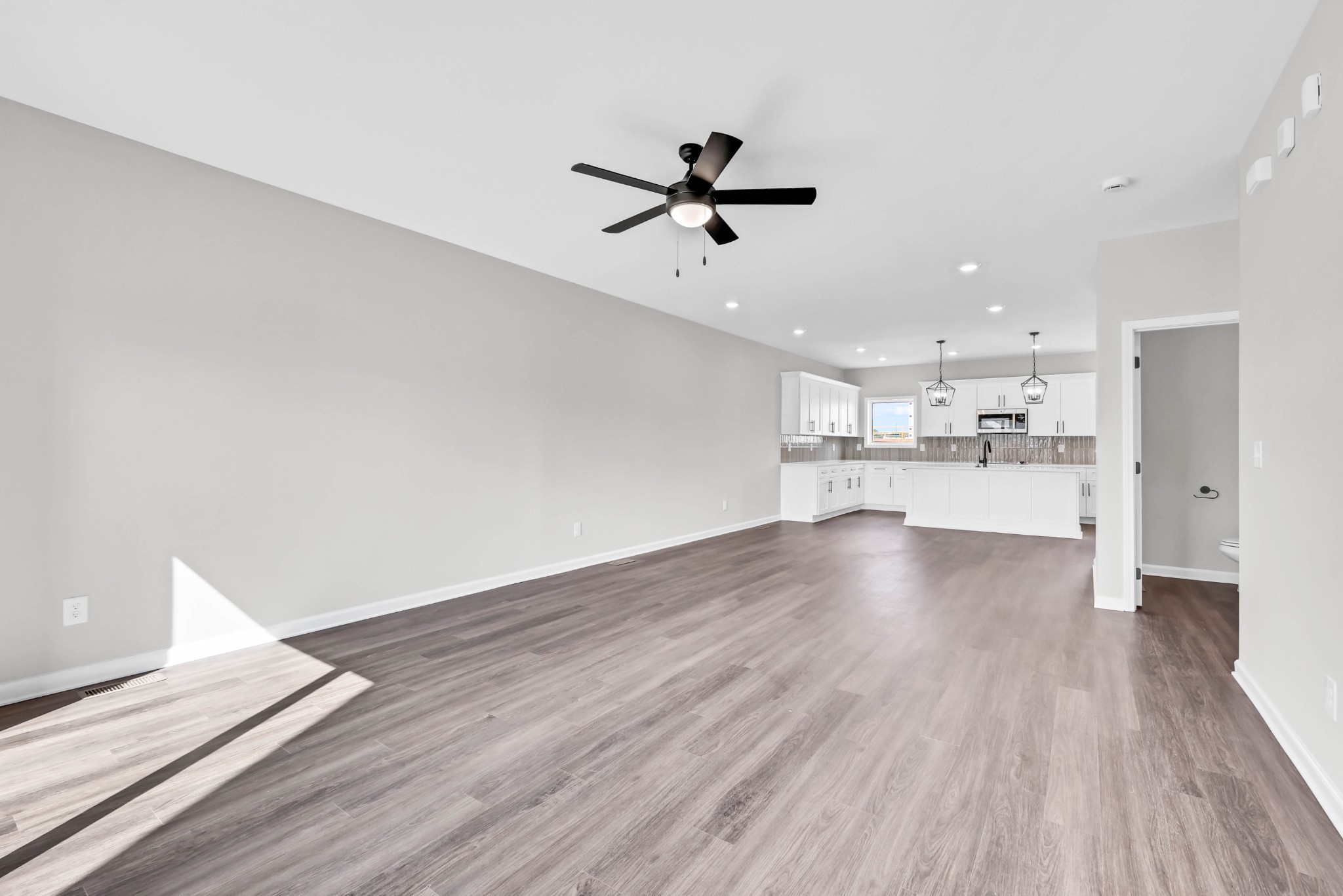 2395 Pea Ridge Road Clarksville, TN 37040 - Photo 6 of 36 a view of a kitchen with wooden floor and a kitchen