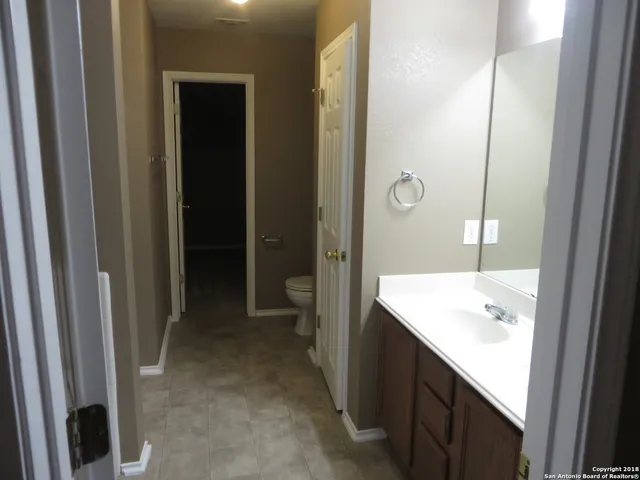 a bathroom with a sink a mirror and a shower