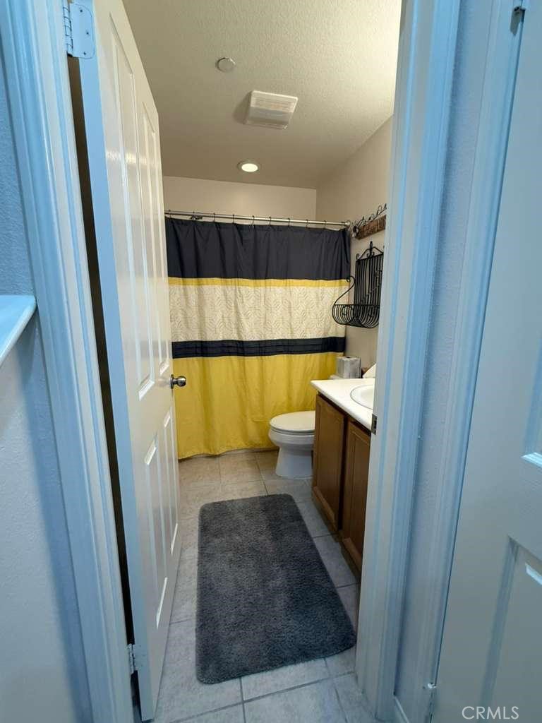 2931 Esperanza Way, Unit B Simi Valley, CA 93063 - Photo 18 of 49 a bathroom with a sink a toilet a walk in closet and a window